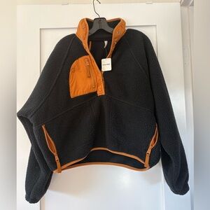 Freepeople fleece pullover, NWT, sz XS. Black and orange